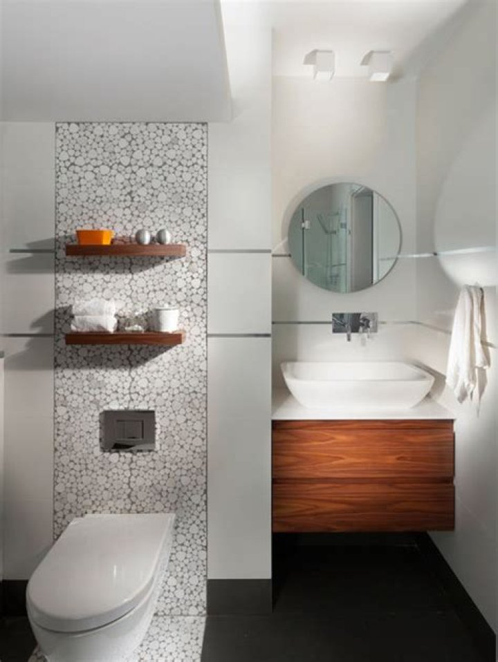 Do you tile behind a toilet?