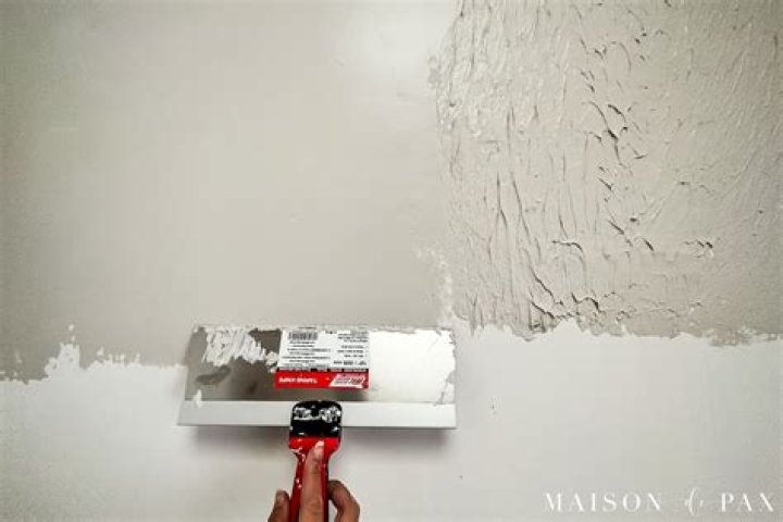How do you fix bumpy paint on walls
