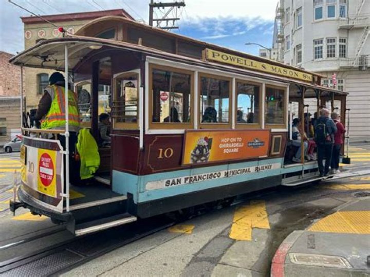 How do you pay for a cable car ride in San Francisco?