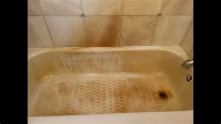How do you remove rust stains from plastic shower stalls?