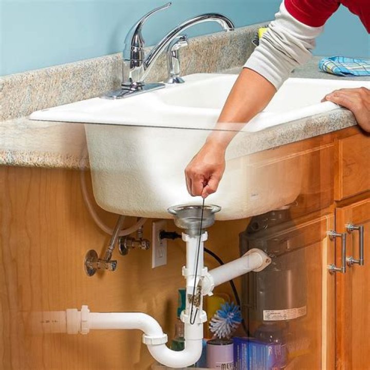 How do you unblock a double sink?
