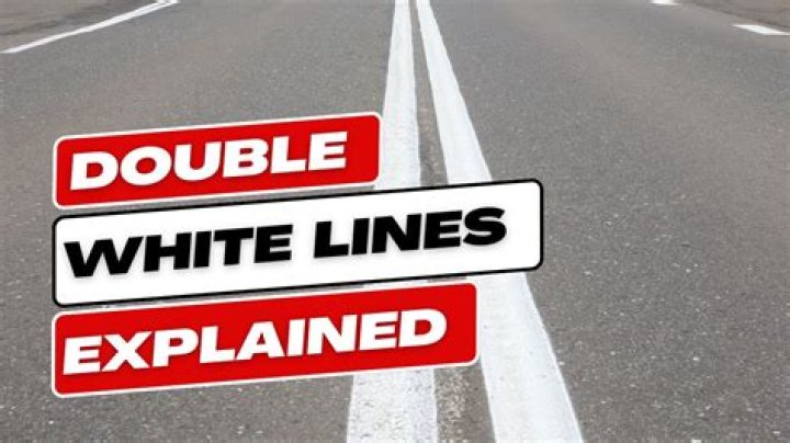 What does a solid double white line mean?
