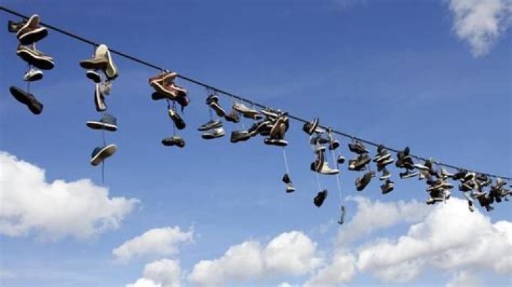 What does shoes hanging on a wire mean