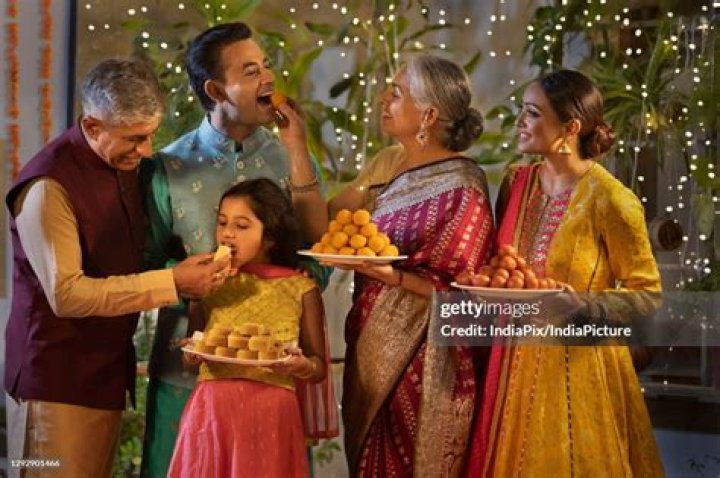 Why do Indians celebrate with sweets?